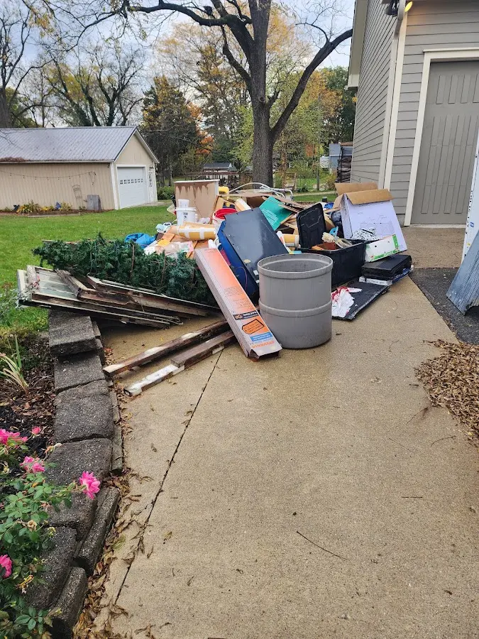 Dumpster being loaded with debris for 30 Yard Dumpster Rental in Scio